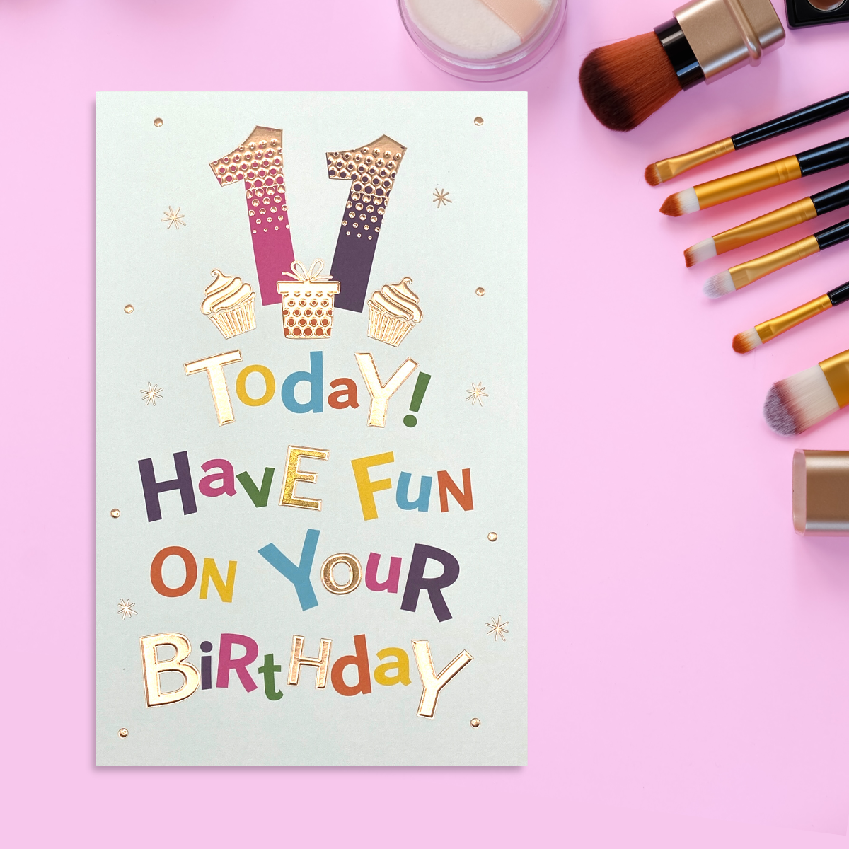 White card with bold colourful text and rose gold details