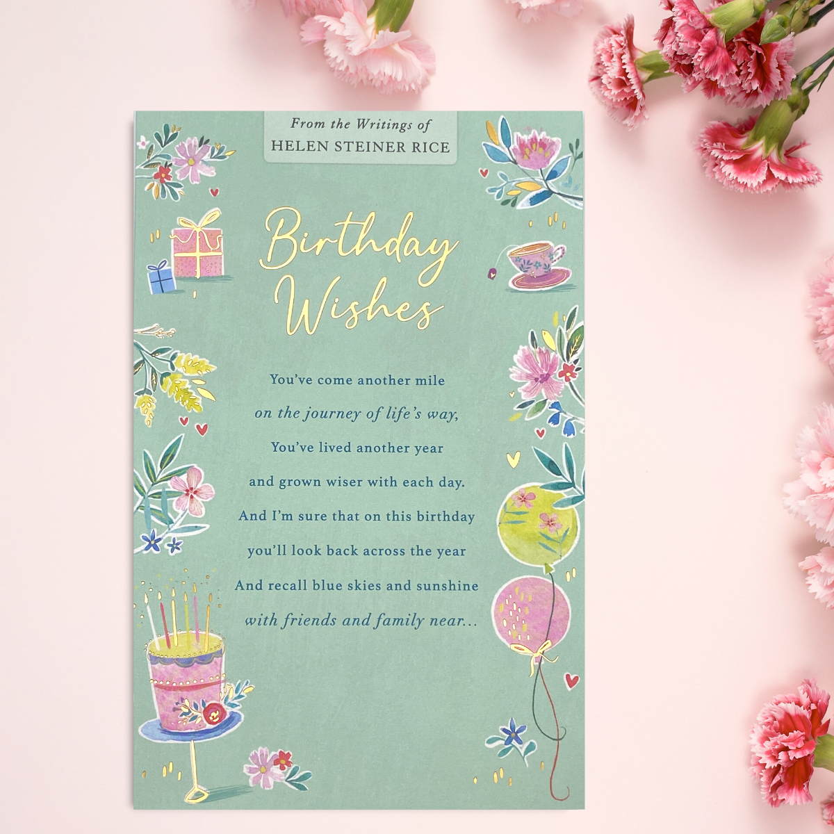 Aqua colour card with floral border and balloons, teacup and cake with verse