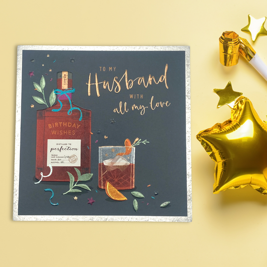 Square card with grey background and whisky glass with foliage and orange slices
