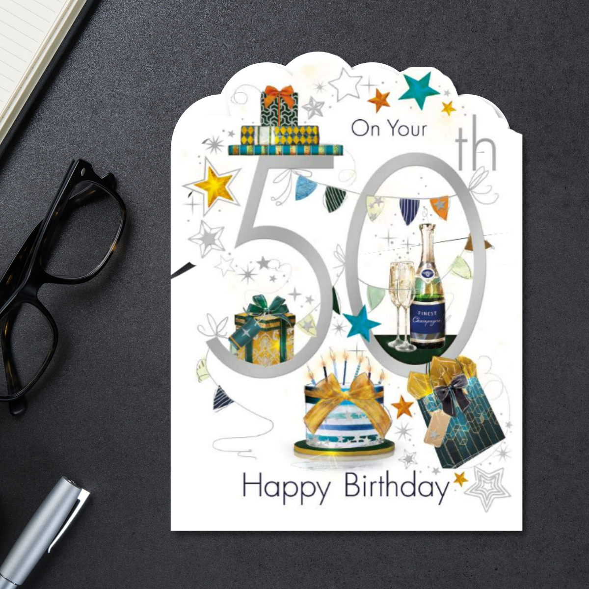 White card with cake, gifts and bubbly among stars
