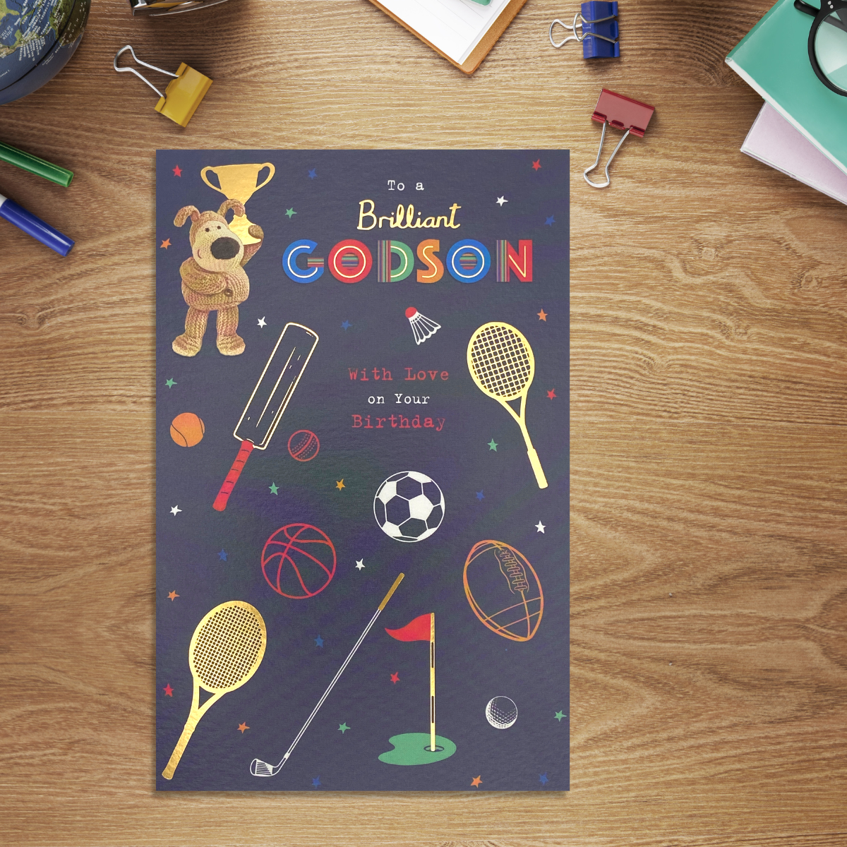 Navy card with Boofle character with sports equipment