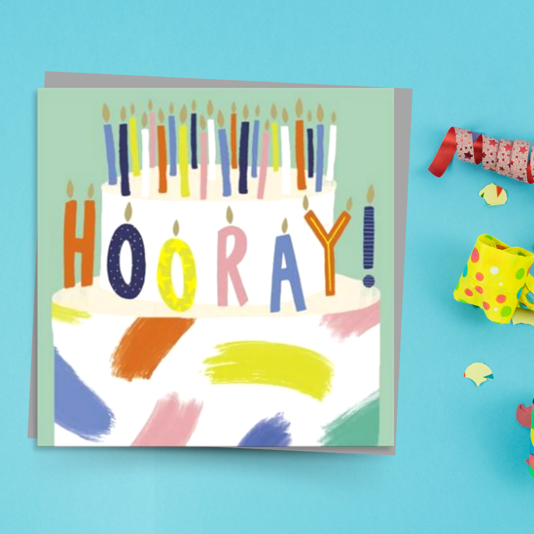 Square green card with painted cake and candles that spell out Hooray!