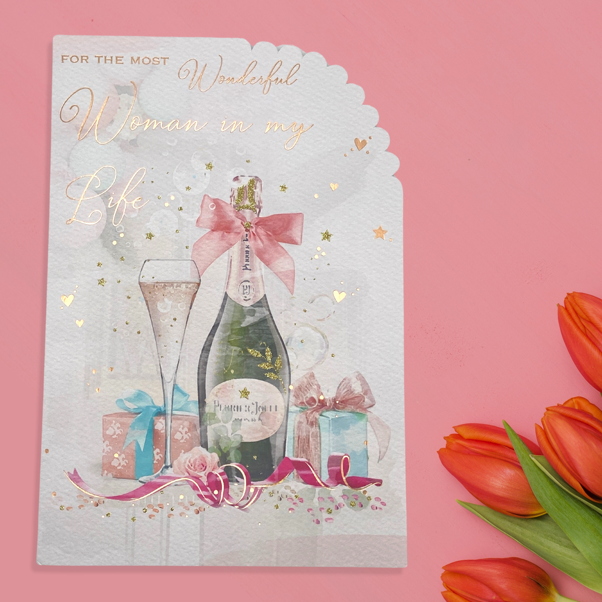 Watercolour illustration of bubbly and gifts with rose gold script text design