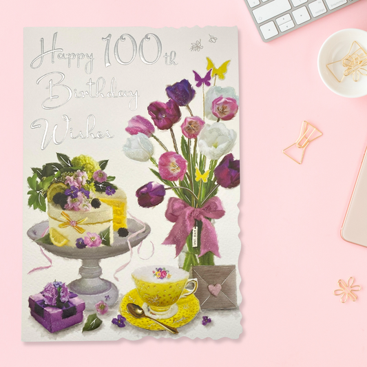 Front image for pretty floral 100th birthday card with colourful cake, teacup and flowers