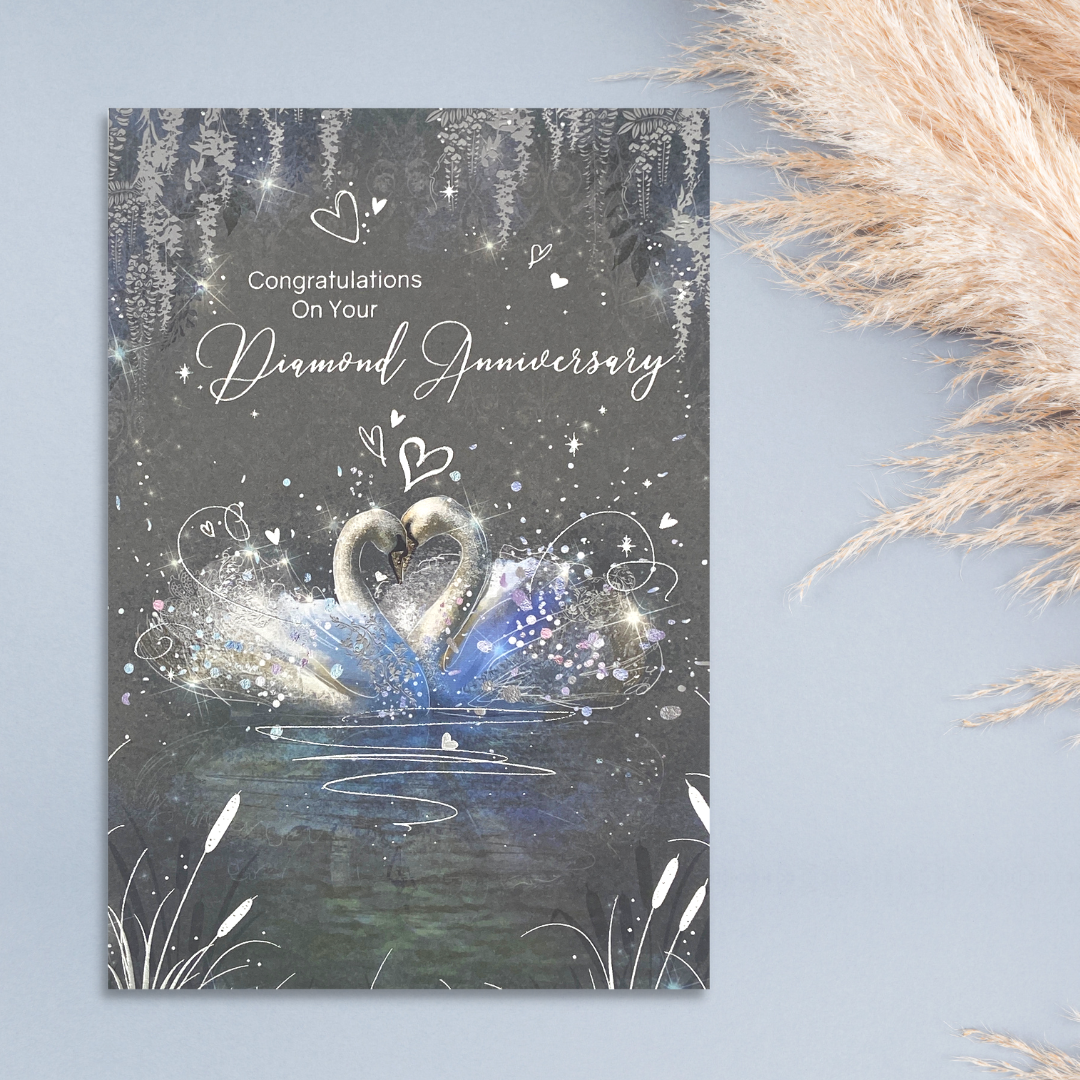 Grey card with two swans embrace surrounded by hearts