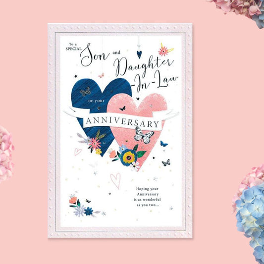 Pink and white card with pink and blue hearts and butterflies