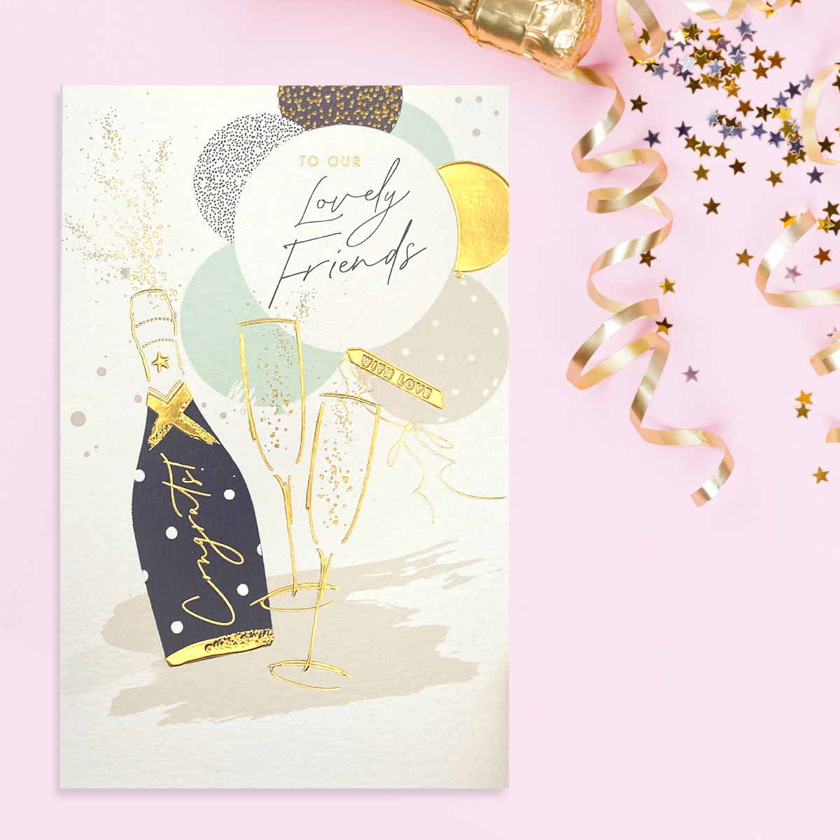 Cream Anniversary Card with champagne flutes and bubbly, gold balloons