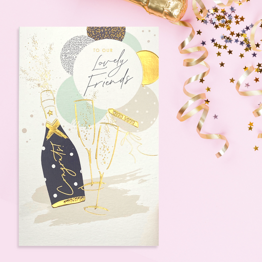 Cream Anniversary Card with champagne flutes and bubbly, gold balloons