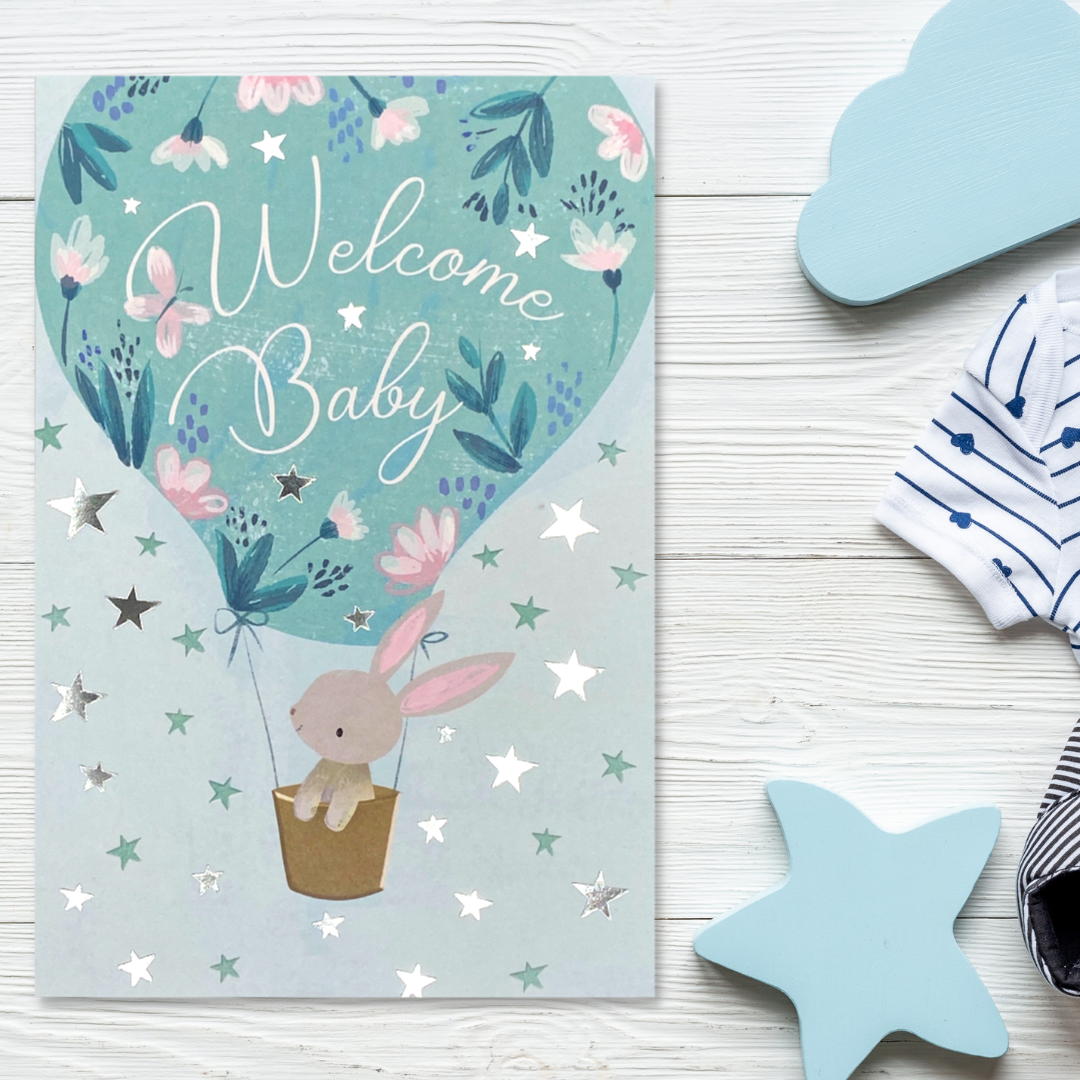 Front image with blue hot air balloon and bunny