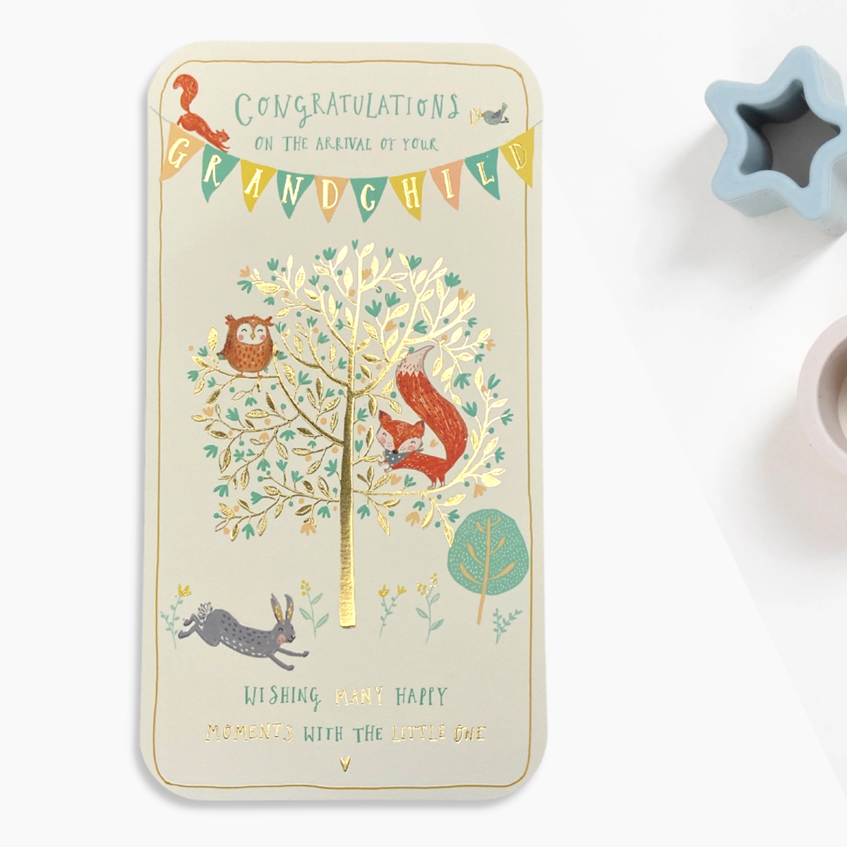 Slim design with cream and gold details, tree and cute animals with bunting