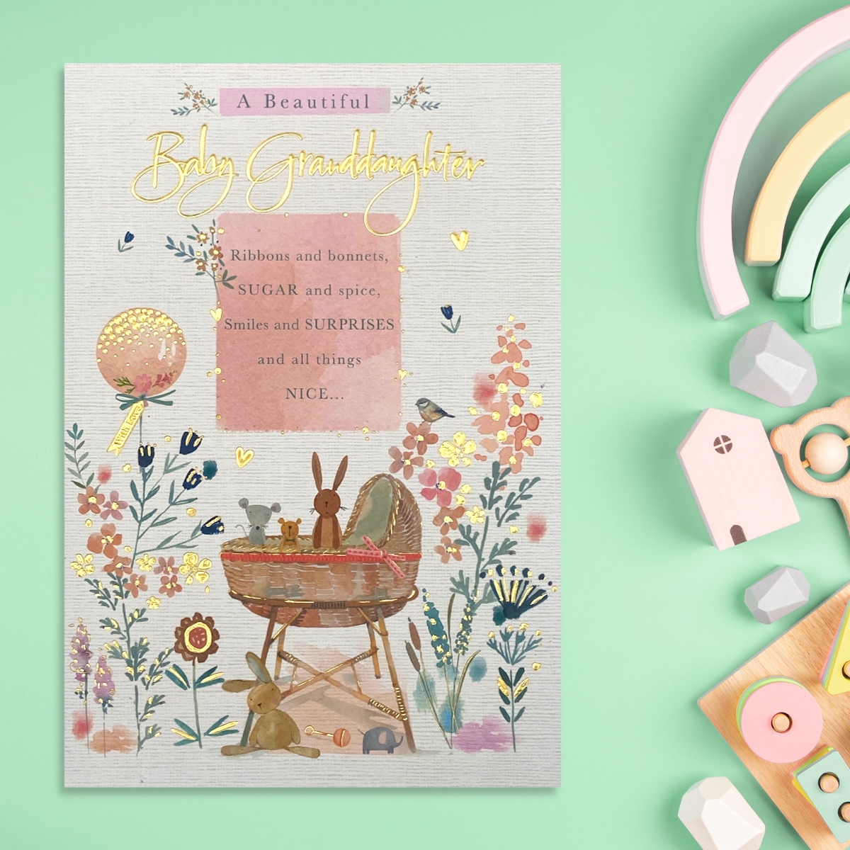 Front image with pram, flowers, balloon and verse