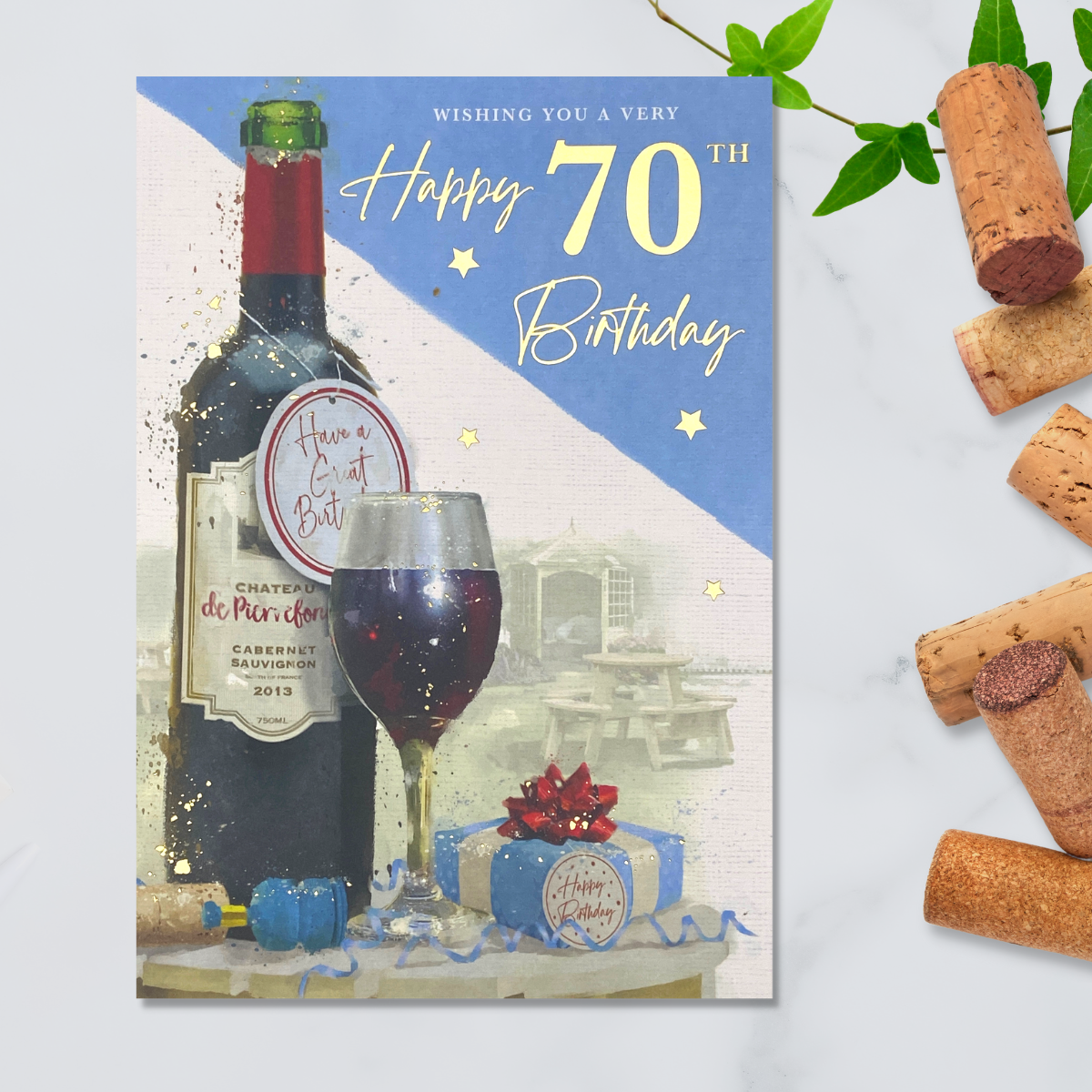 Blue and white design with red wine bottle and gift