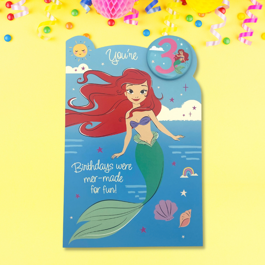 Ariel in water with shells and badge with age 3 and ariel on  it