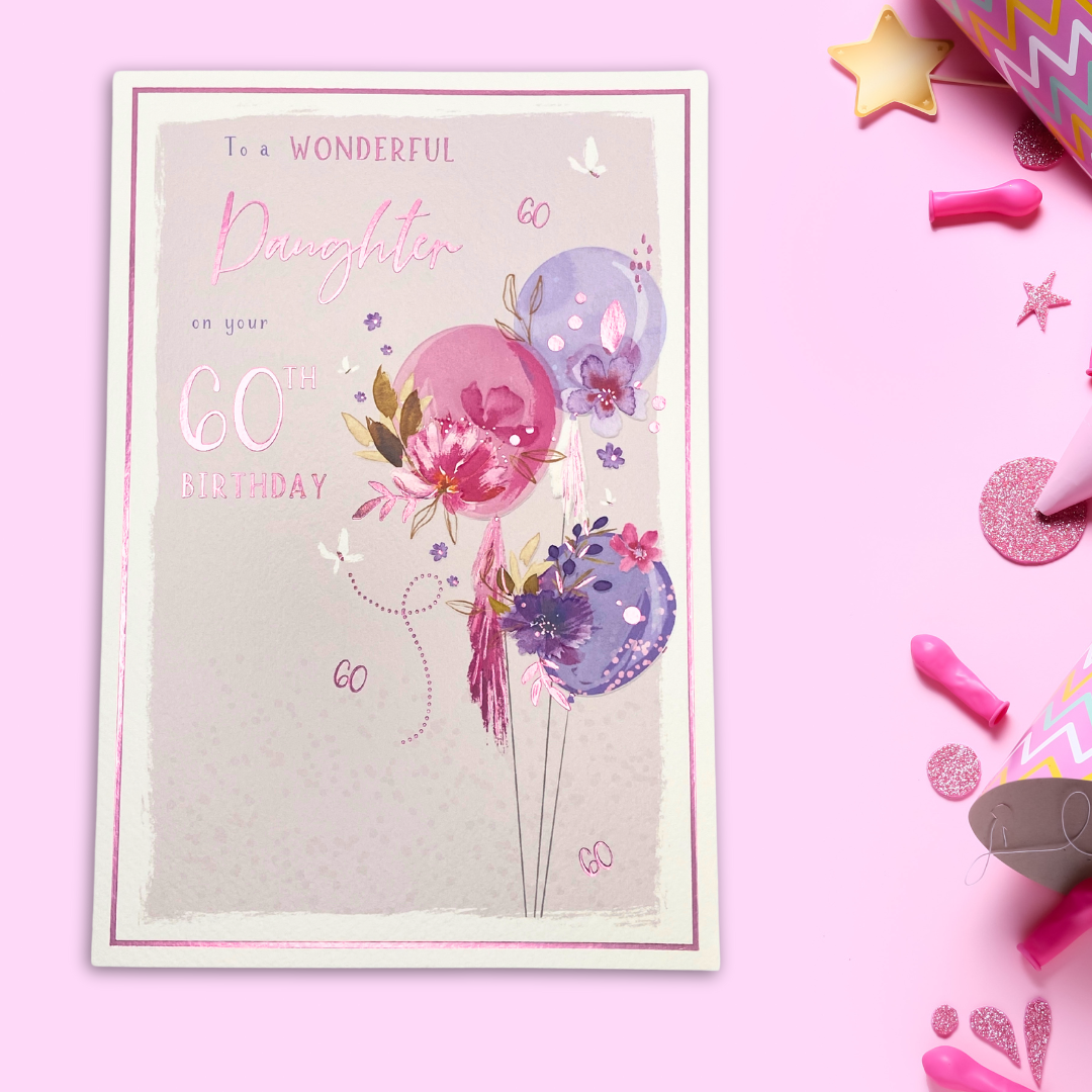 White card with pink and lilac balloons with floral details and pink foil details.