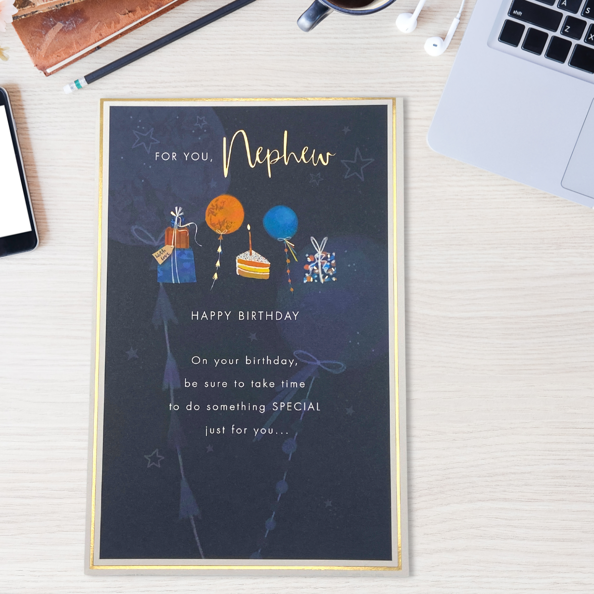 Front image with navy design, cake, gifts and balloons with verse