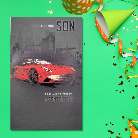 Black card with night skyline and red sports car design