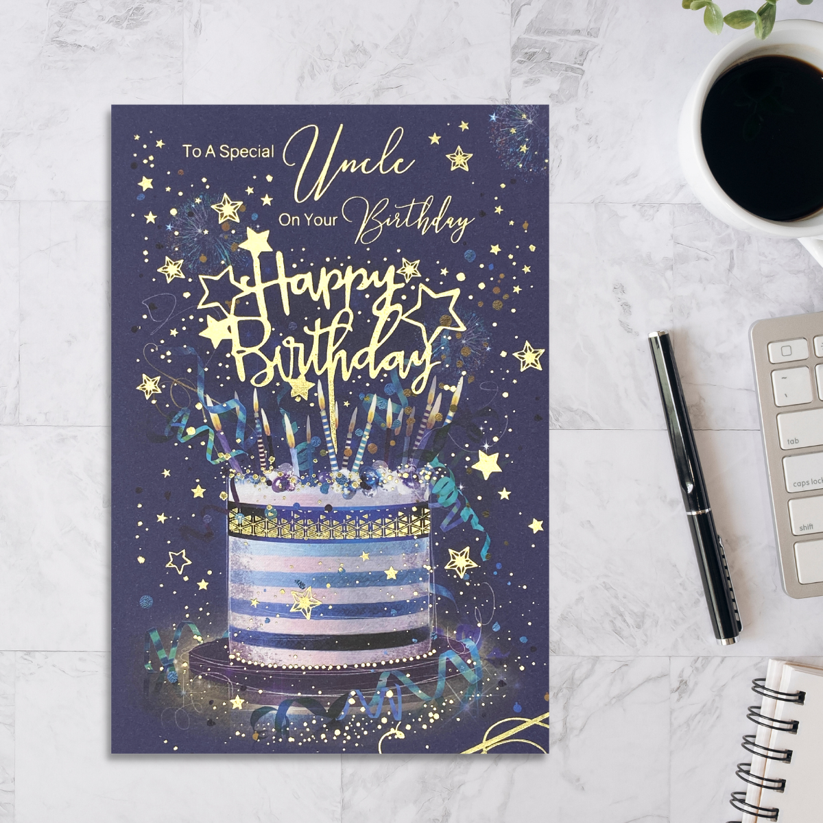Blue Card with blue and white striped cake and candles. Gold foil details