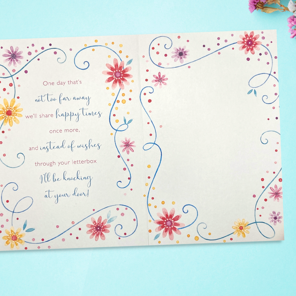 Two further pages showing verse with floral border