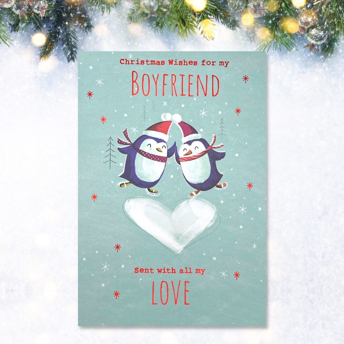Aqua card with two penguins dancing on heart with red foil text