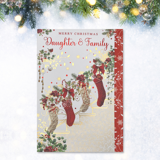 Red and white card with stocking hanging up staircase with floral garland