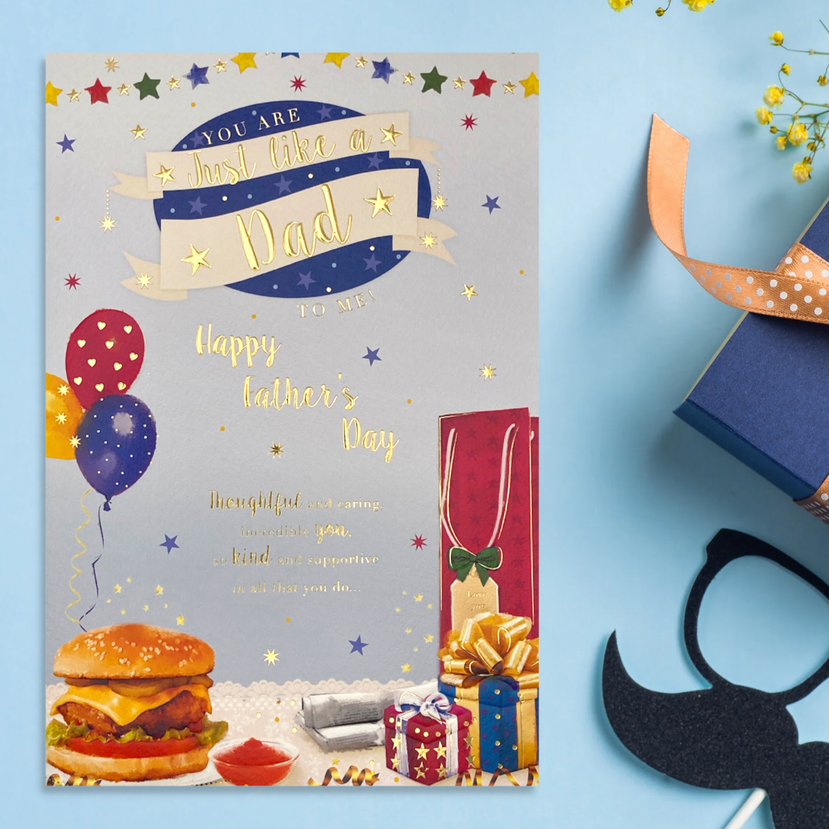 Front image showing coloured card with burger, gifts balloons and stars