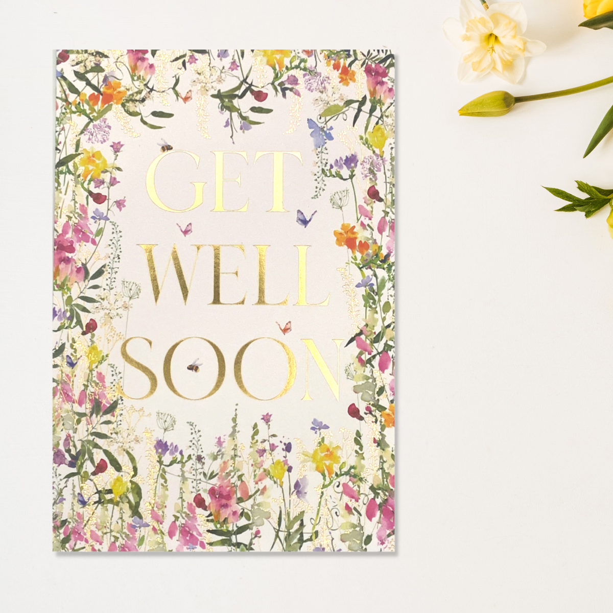 Front image with gold GET WELL SOON text and wild flower border