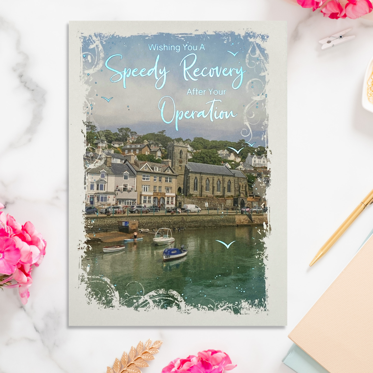 Front image with harbour scene and blue foil text