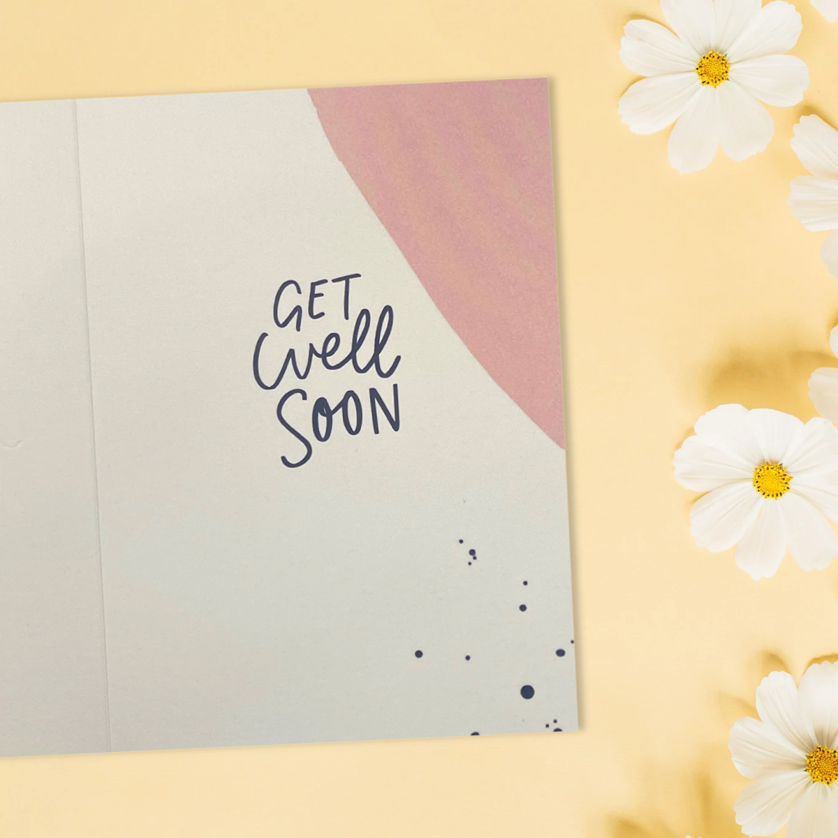 Inside image with paint splodges and black get well soon text