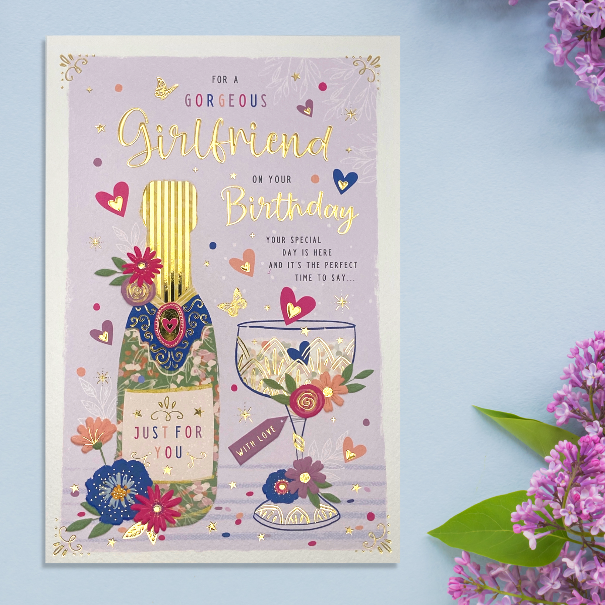 Lilac theme card with floral champagne and glass design