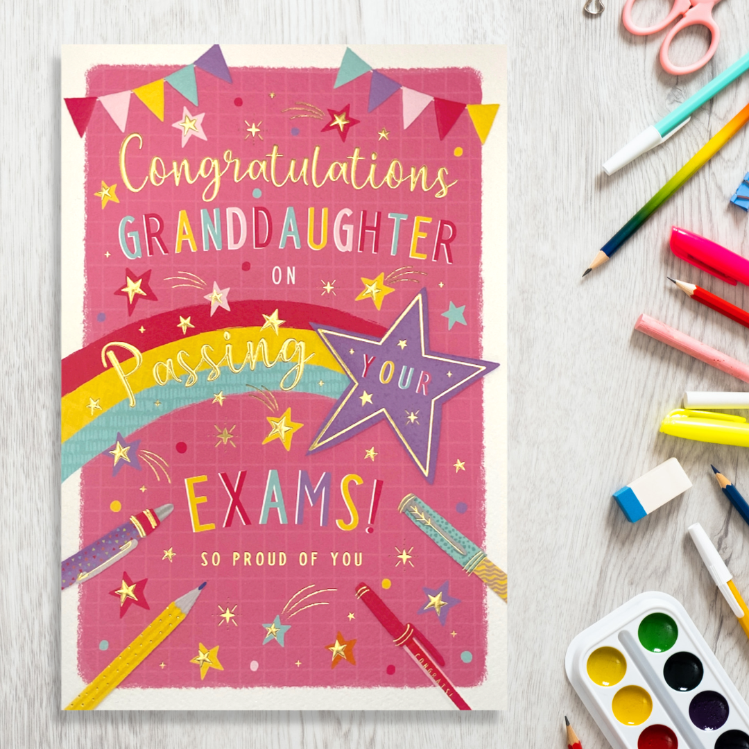 Front image showing bold pink design with bunting, stars and stationary with text