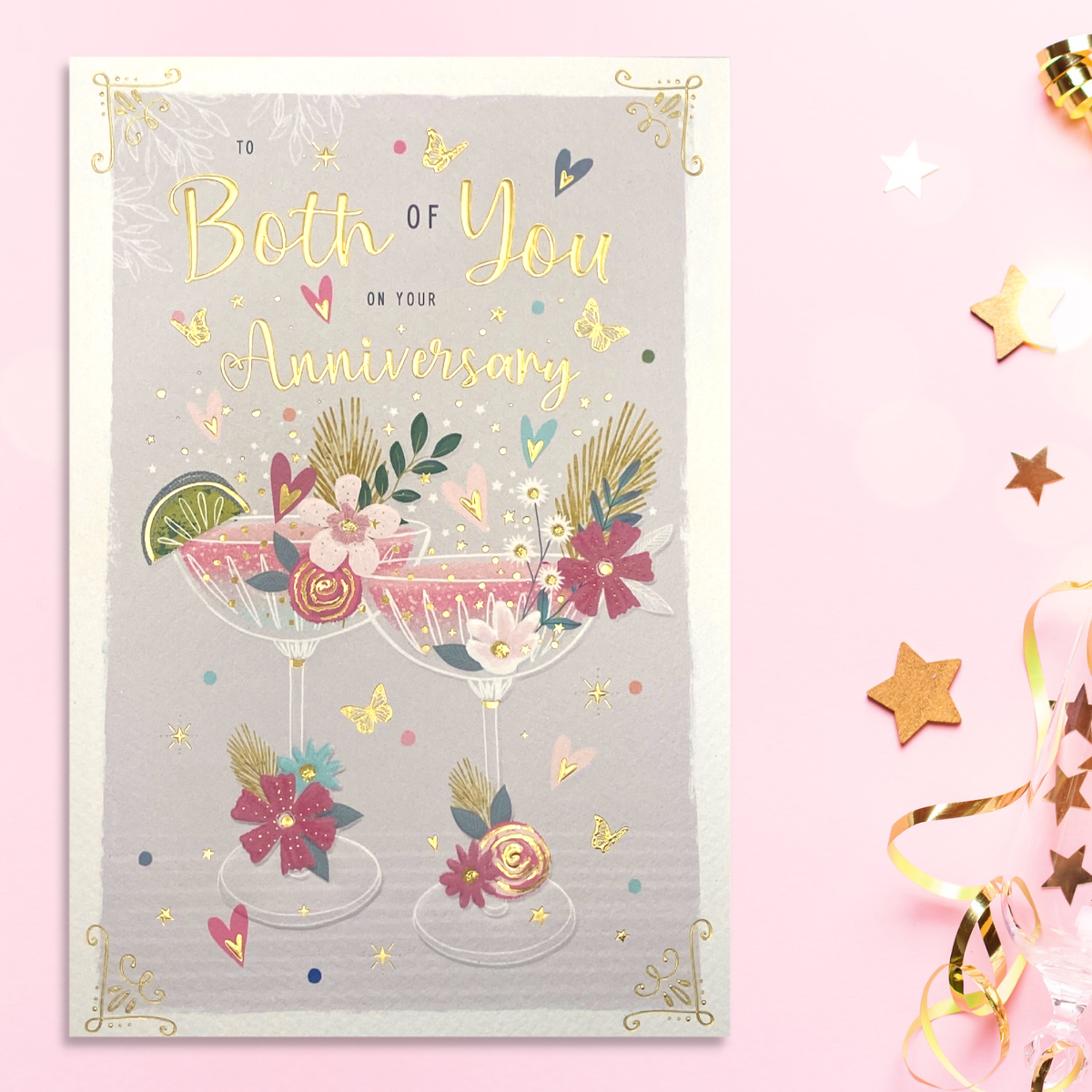 Front image with two glasses of bubbly with flowers, hearts and butterflies