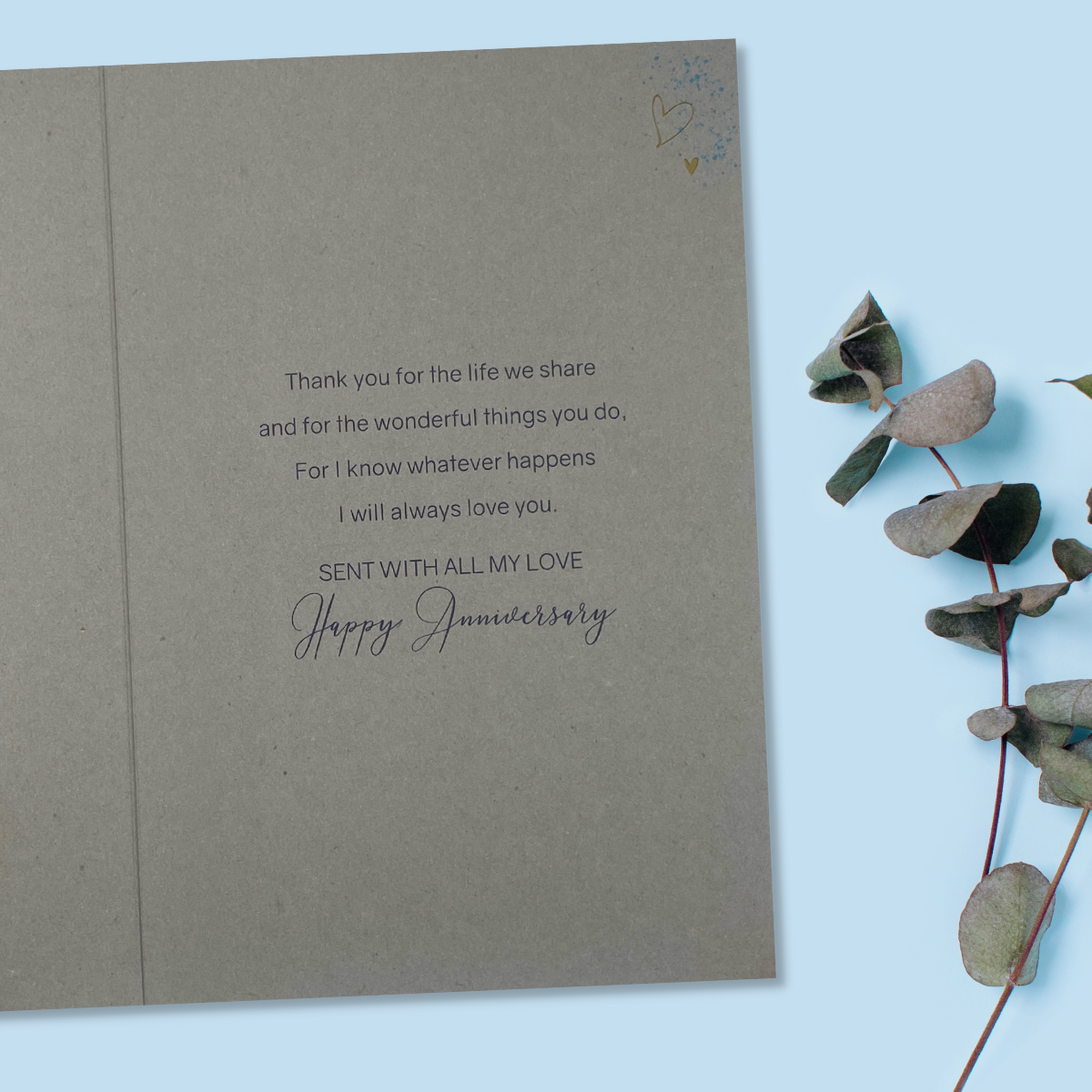 Inside with grey card and navy text