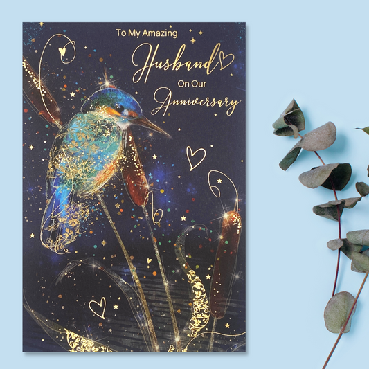 Front image of bright colour Kingfisher on dark background with gold foil details