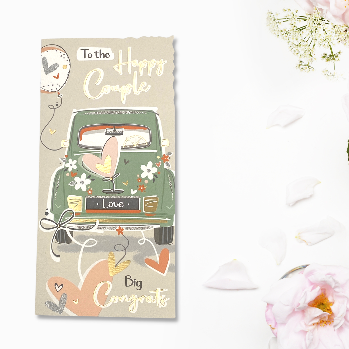 Green card with wedding hearts and flowers design and gold foil text