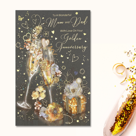 Grey card with two flutes clinking surrounded by gifts adnd flowers