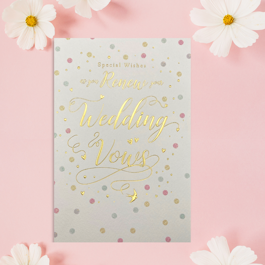 White card with pastel dots and gold foil text