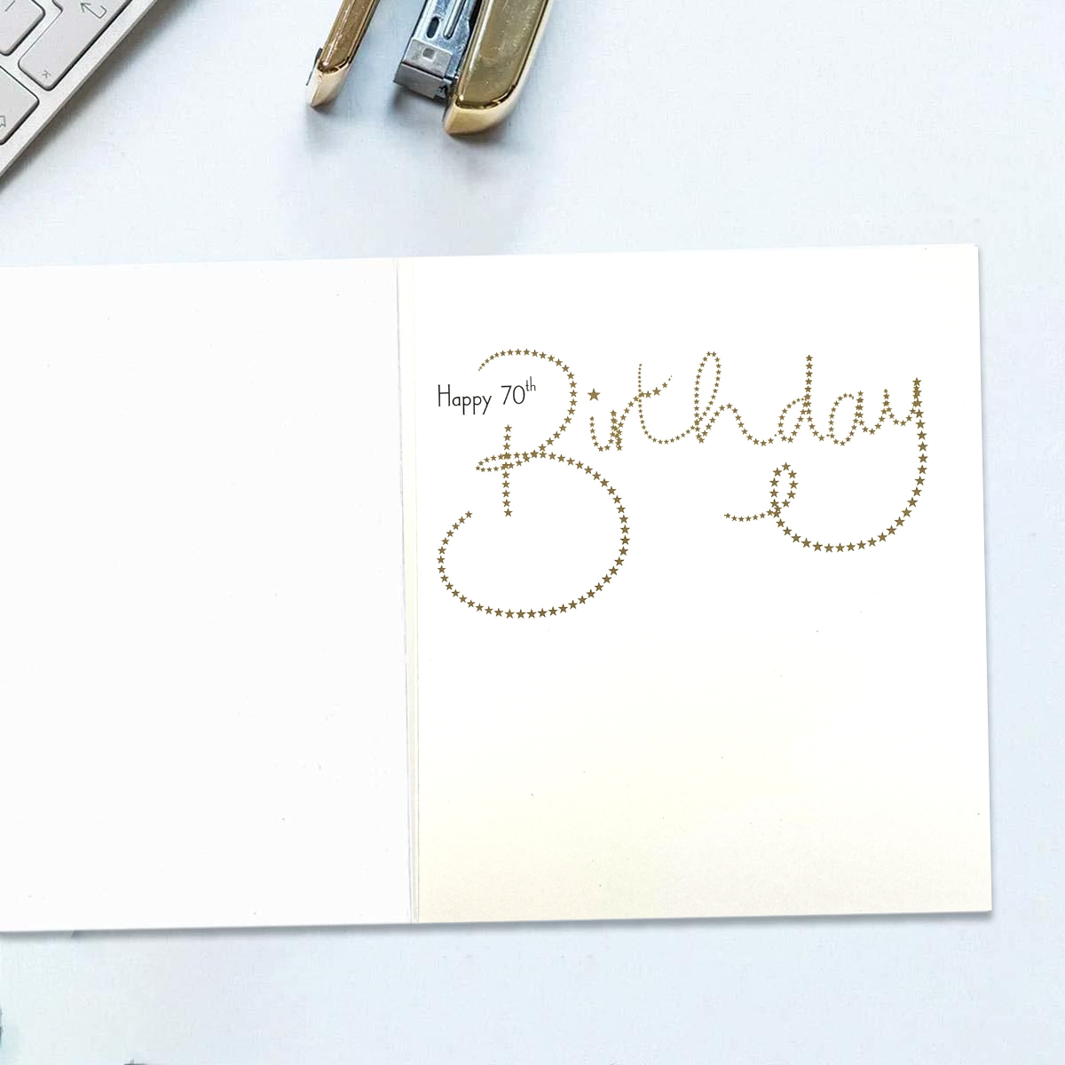 Inside card, white background with black and gold text