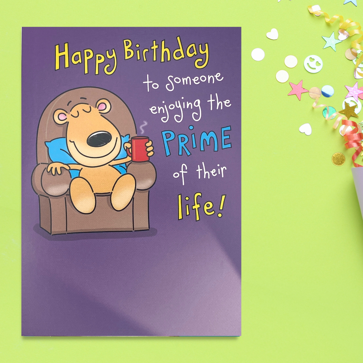 A cartoon bear in chair with cuppa relaxing