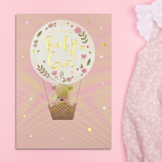 Front image with Nutmeg character in hot air balloons with flowers