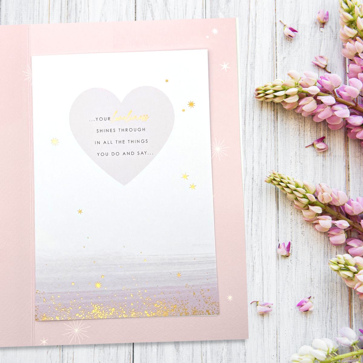 Inside image with pink border and gold details with verse