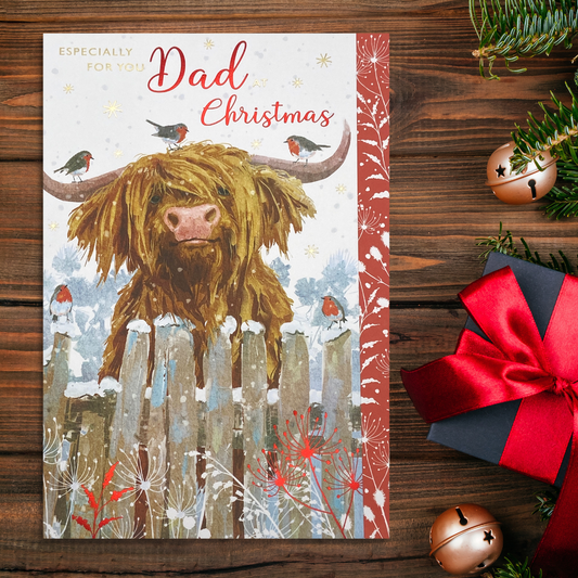 Highland cow with robins behind fence, with red floral border