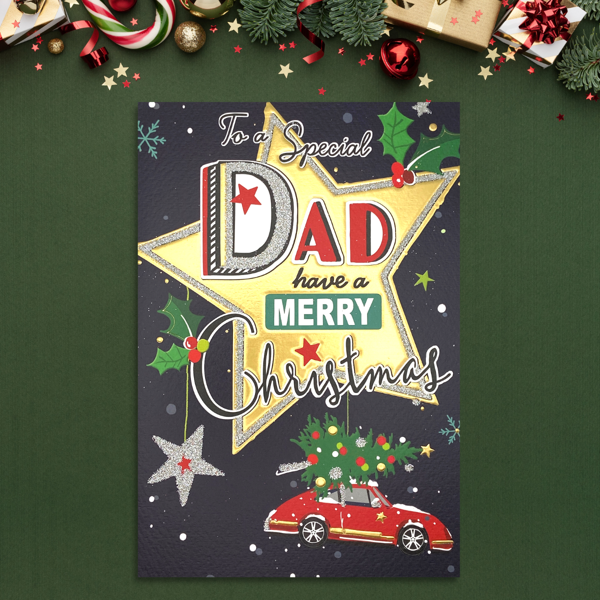 Navy card with gold star and red car with tree