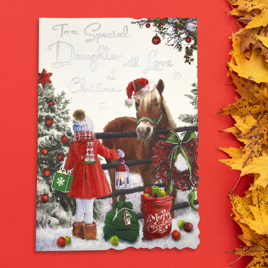 Little girl visiting horse in snow design