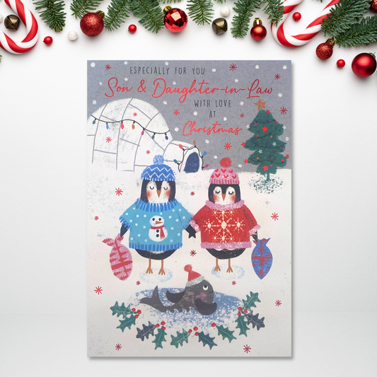 Two cartoon penguins in  the snow with igloo and whale