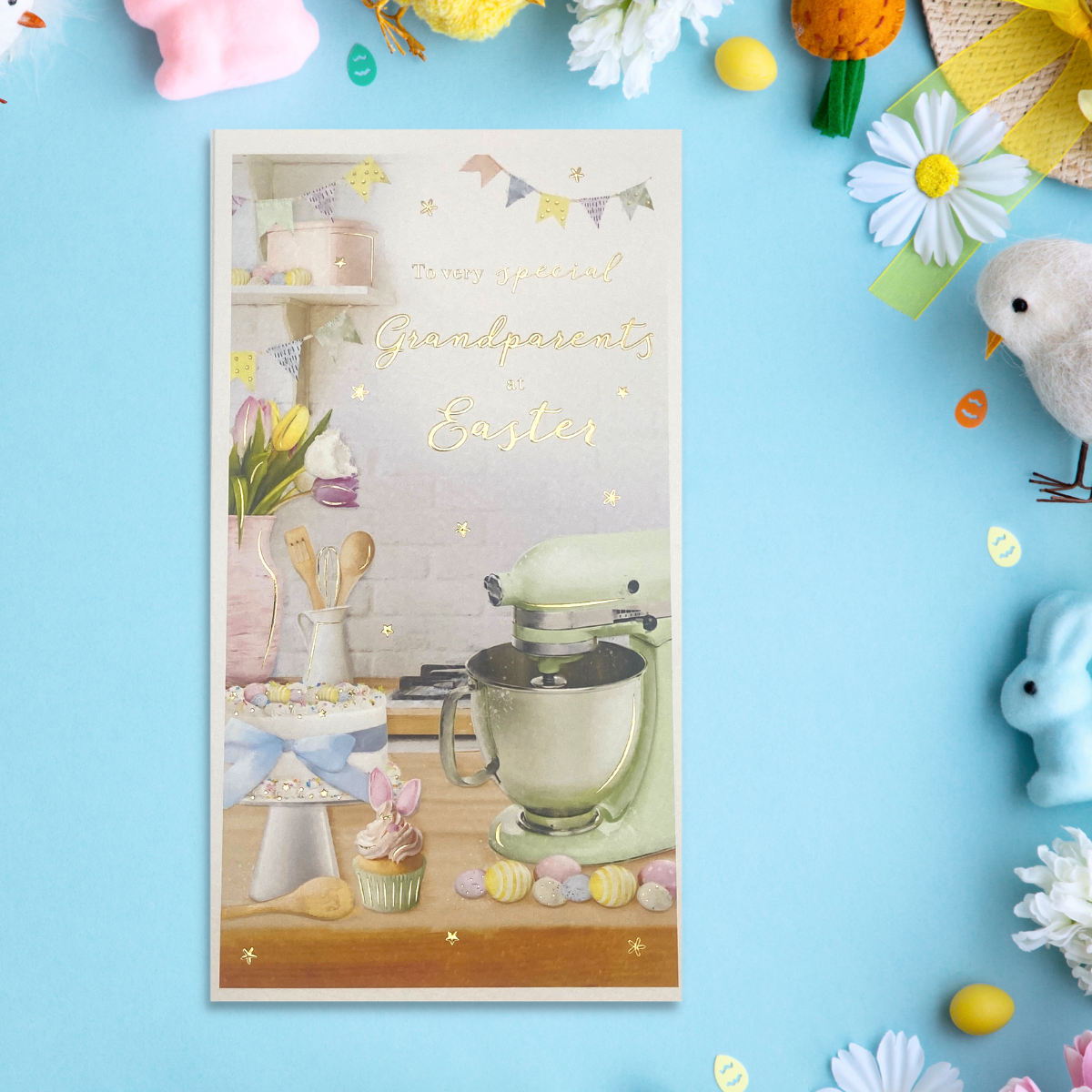 Slim card with white border and baking scene with gold foil text