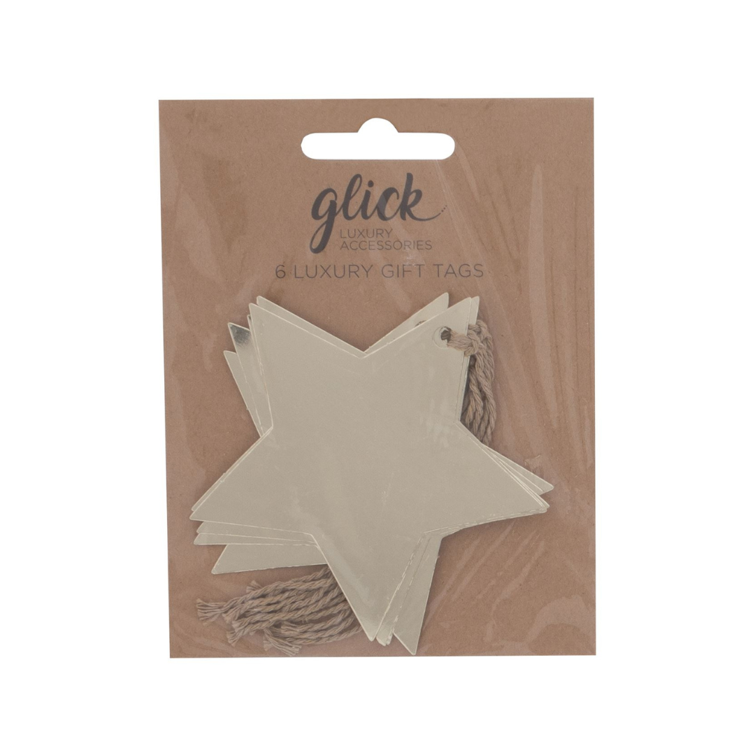 Gold Foil star shaped gift tags on kradt backboard