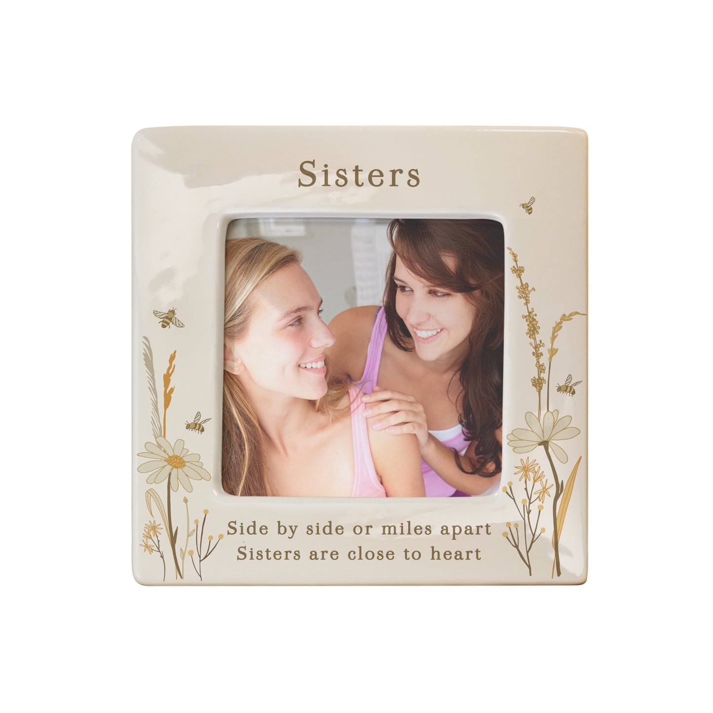 Decorative photo frame with floral designs and text about sisters on a white background