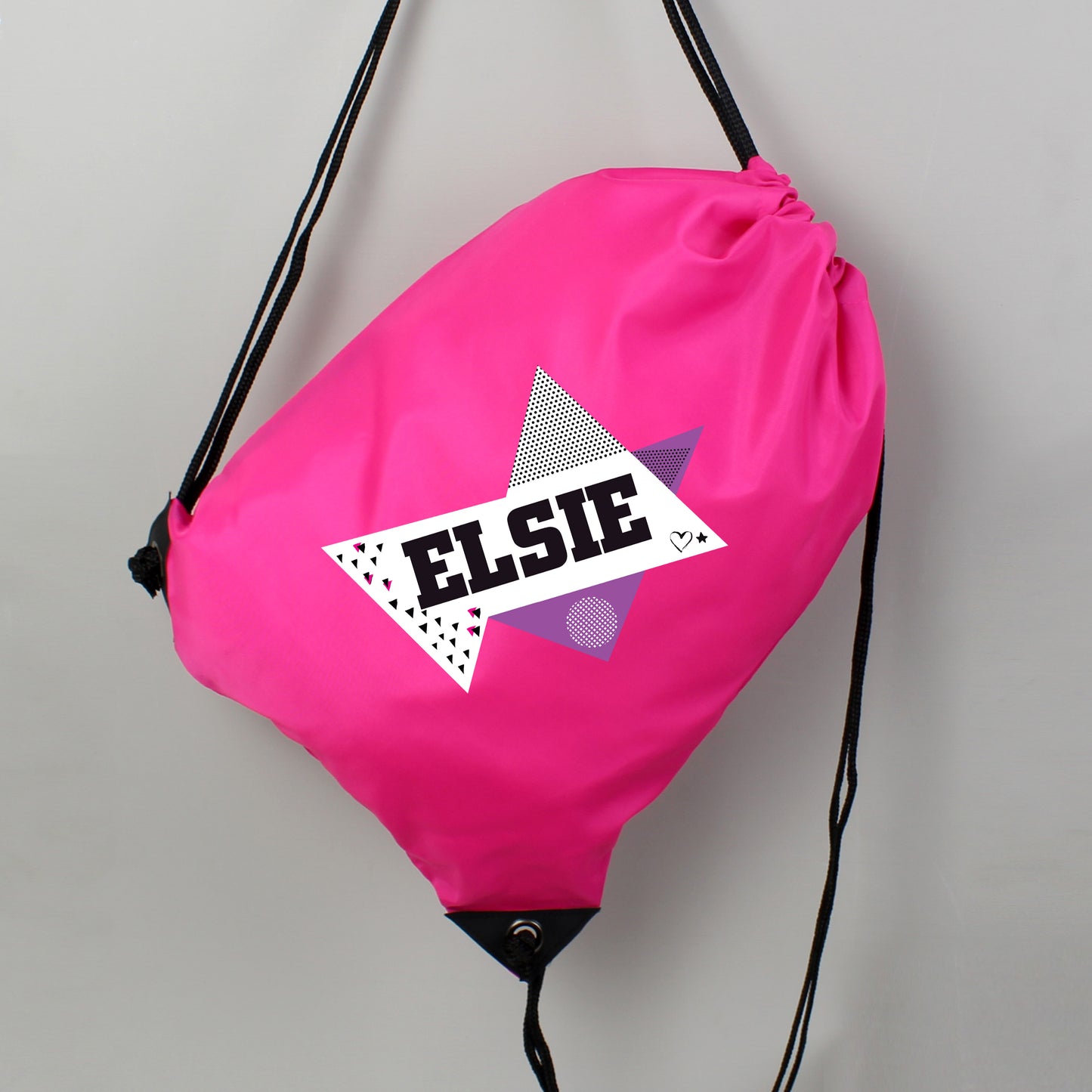 Pink drawstring bag with 'Elsie' logo on a gray background