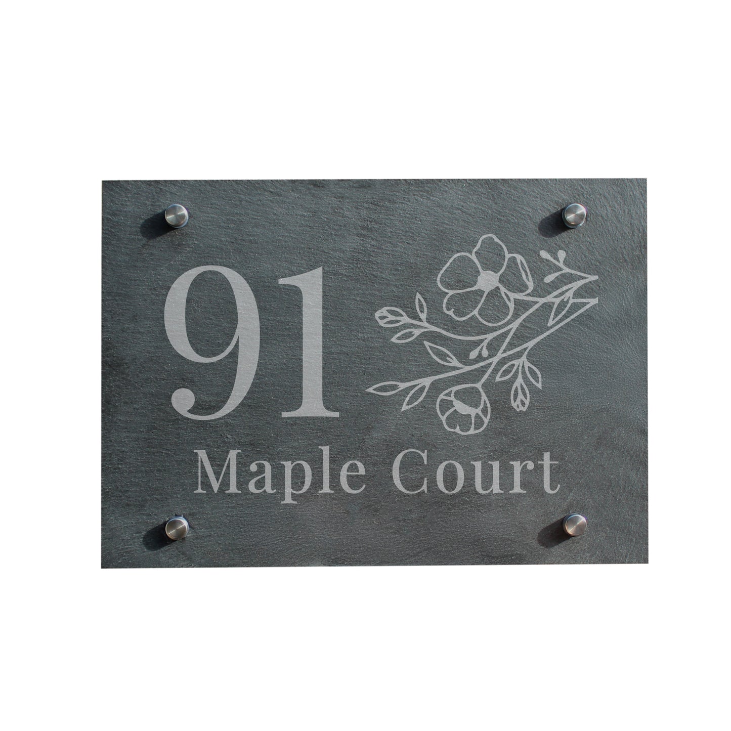 Slate house sign with engraved number and text on a white background