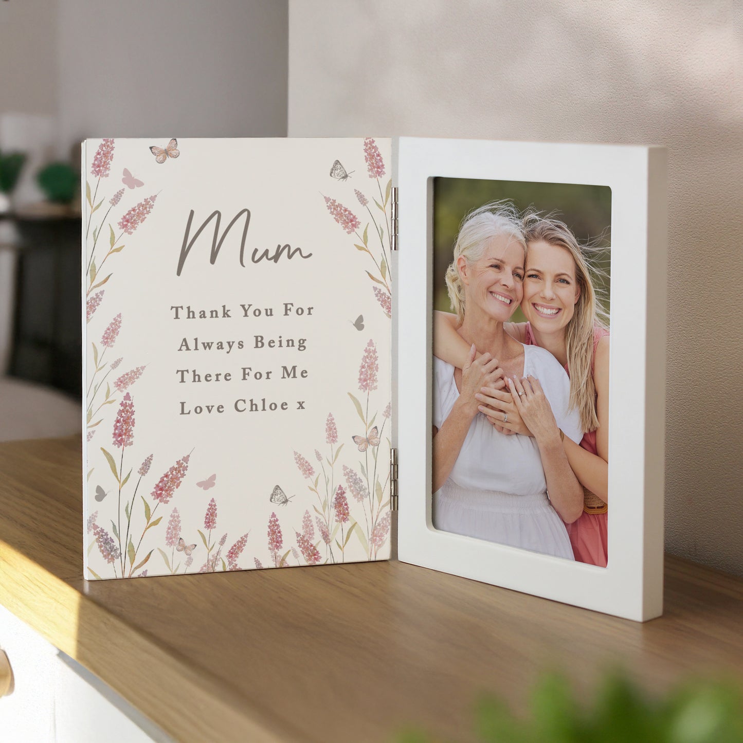 Personalised photo frame with floral design and a photo of two women hugging.